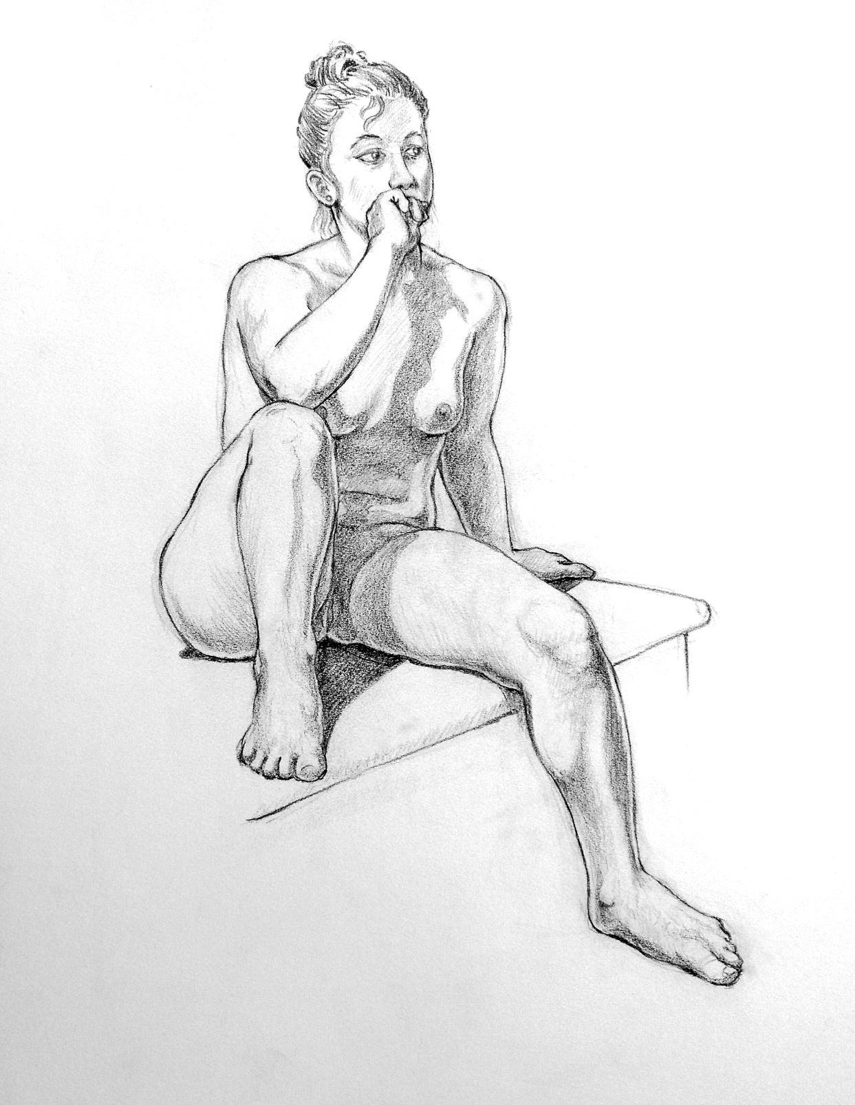 Young woman, seated, foreshortened.